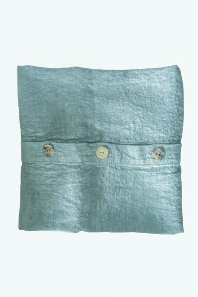 We are delighted to present this washed linen pistachio blue cushion cover, hand finished natural mother-of-pearl buttons from the Renaissance town of Carpi, south of Verona & North of Florence